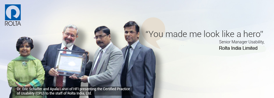 Banner - Dr Eric Schaffer and Apala Lahiri of HFI presenting the Certified Practice in Usability to the staff of Rolta India Ltd.
